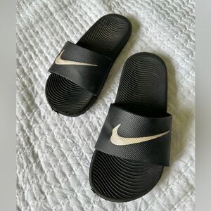 Boys Nike slides.  Size 2/3.  Black with white logo.